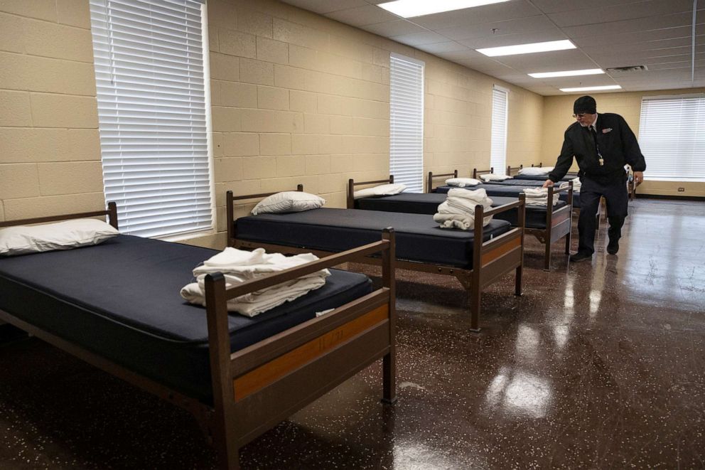 PHOTO: Salvation Army of Odessa's Major Luis Melendez inspects beds in the men's dormitory of the Mabee Red Shield Lodge as the shelter prepares to open as an emergency cold weather shelter for the winter storm, Feb. 2, 2022 in Odessa, Texas.