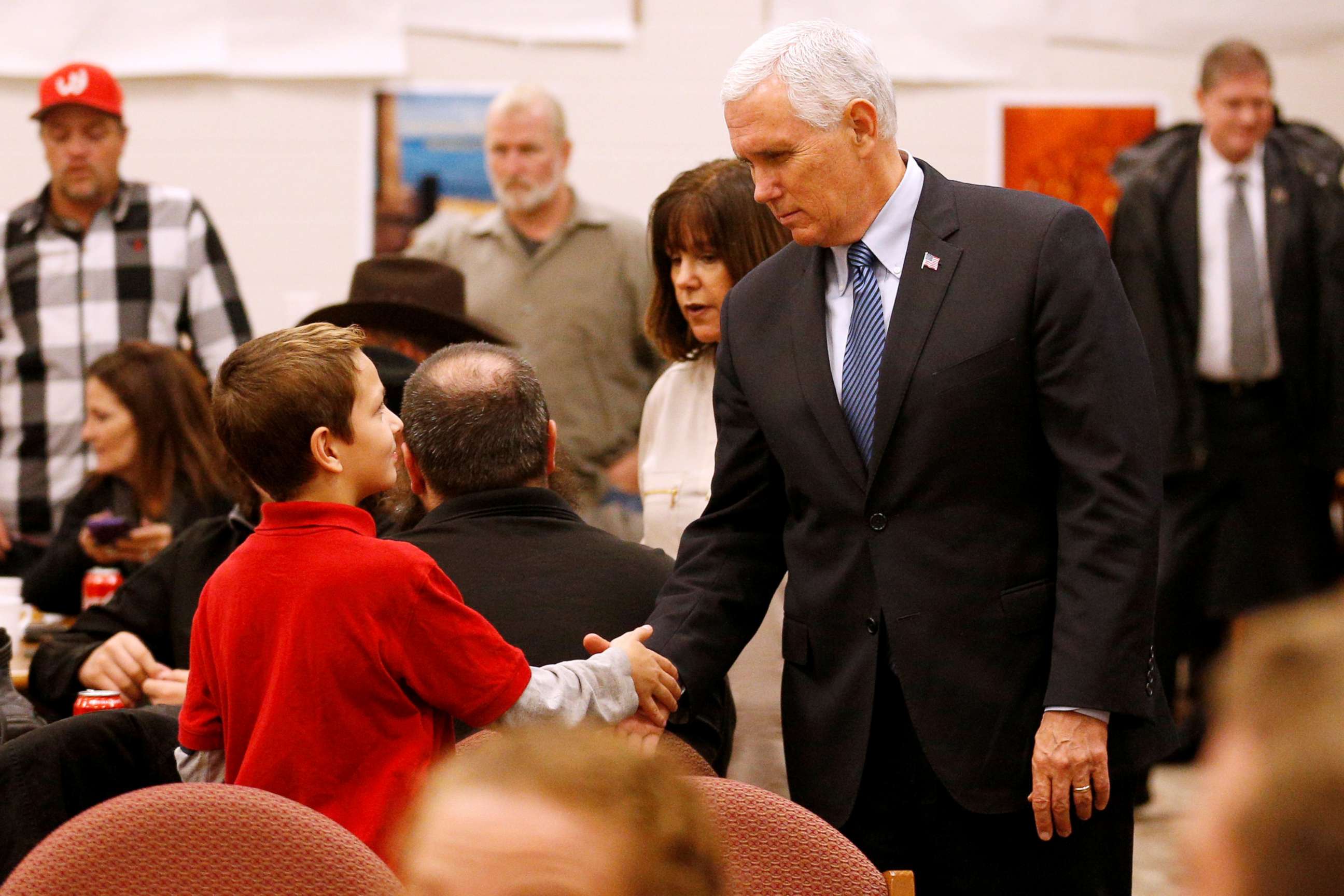 PHOTO: Vice President Mike Pence greets a young boy at Floresville high school during a visit with family and victims of the shooting at First Baptist Church in Sutherland Springs, before a vigil in Floresville, Texas, Nov. 8, 2017.