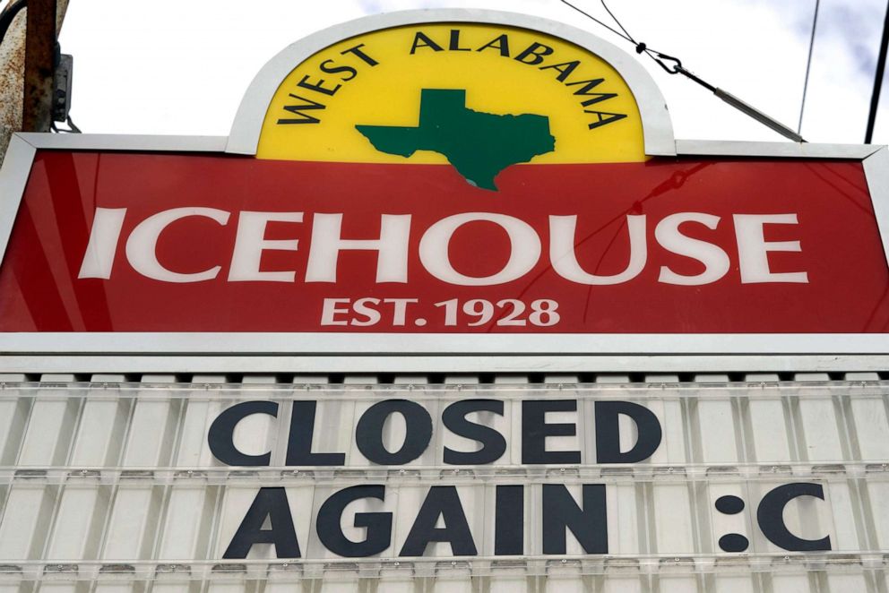 PHOTO: A sign outside the West Alabama Icehouse on June 29, 2020, in Houston, reads, "Closed Again :(." 