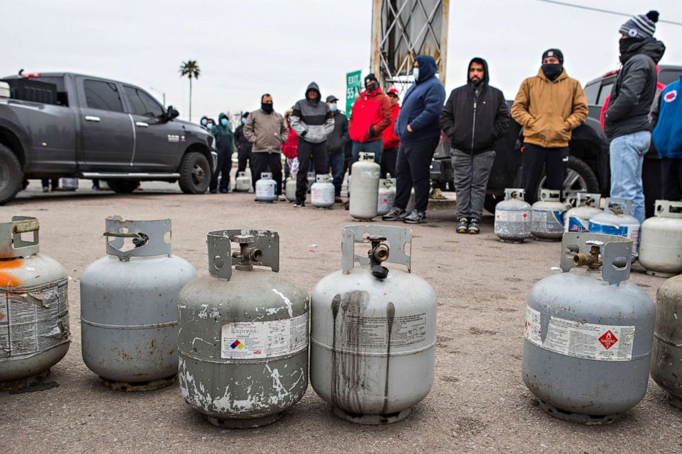 PHOTO: People line up to fill their empty propane tanks on Feb. 16, 2021, in Houston. Temperatures stayed below freezing Tuesday, and many residents were without electricity.