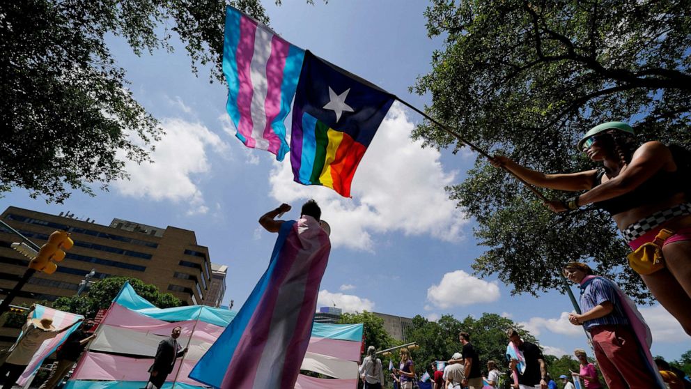 PHOTO: In this May 20, 2021, file photo, demonstrators gather on the steps to the State Capitol to speak against transgender-related legislation bills being considered in the Texas Senate and Texas House, in Austin, Texas.