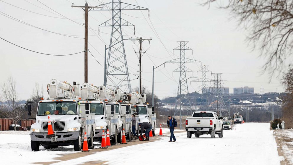 PHOTO: Pike Electric service trucks line up after a snow storm, Feb. 16, 2021, in Fort Worth, Texas.