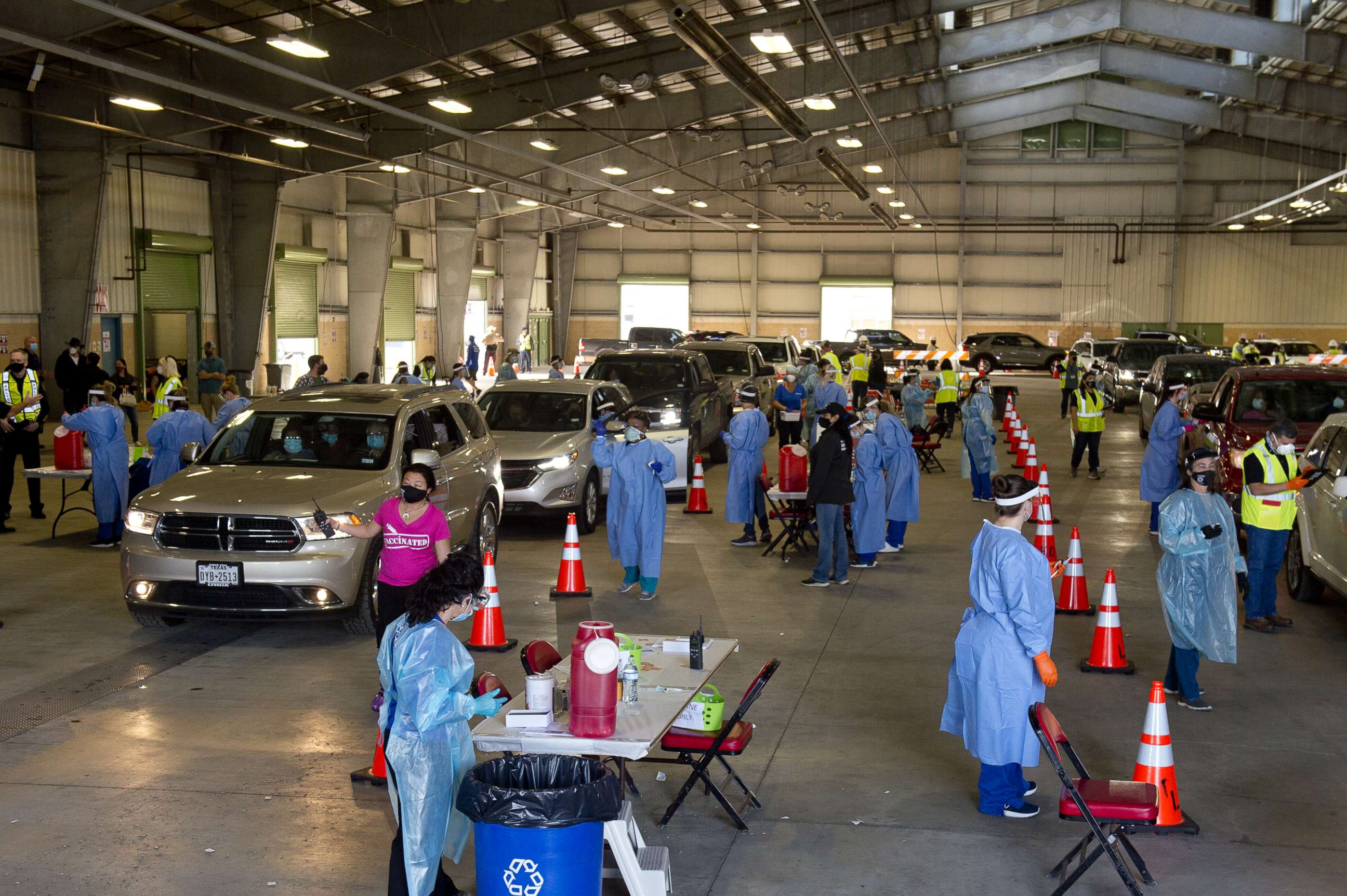 PHOTO: Healthcare workers administer doses of the Moderna Covid-19 vaccination at a drive-thru clinic at the Richard M. Borchard Regional Fairgrounds in Robstown, Texas, Jan. 26, 2021.