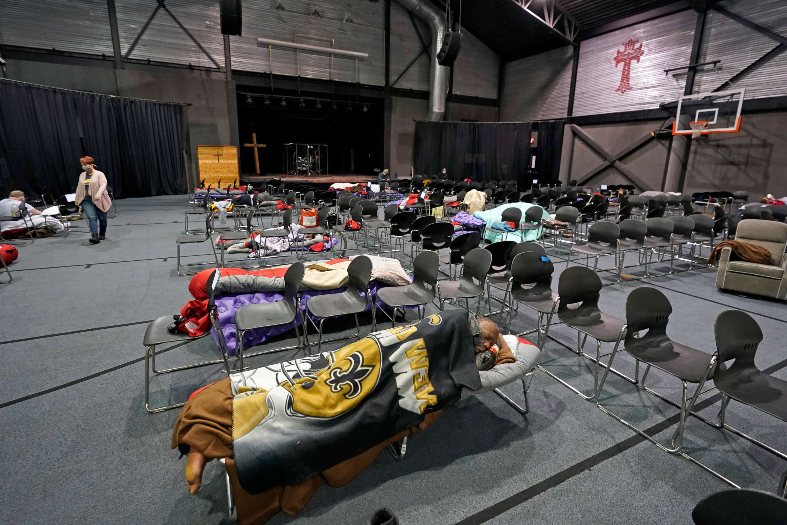 PHOTO: People seeking shelter from below freezing temperatures rest inside a church warming center Tuesday, Feb. 16, 2021, in Houston.