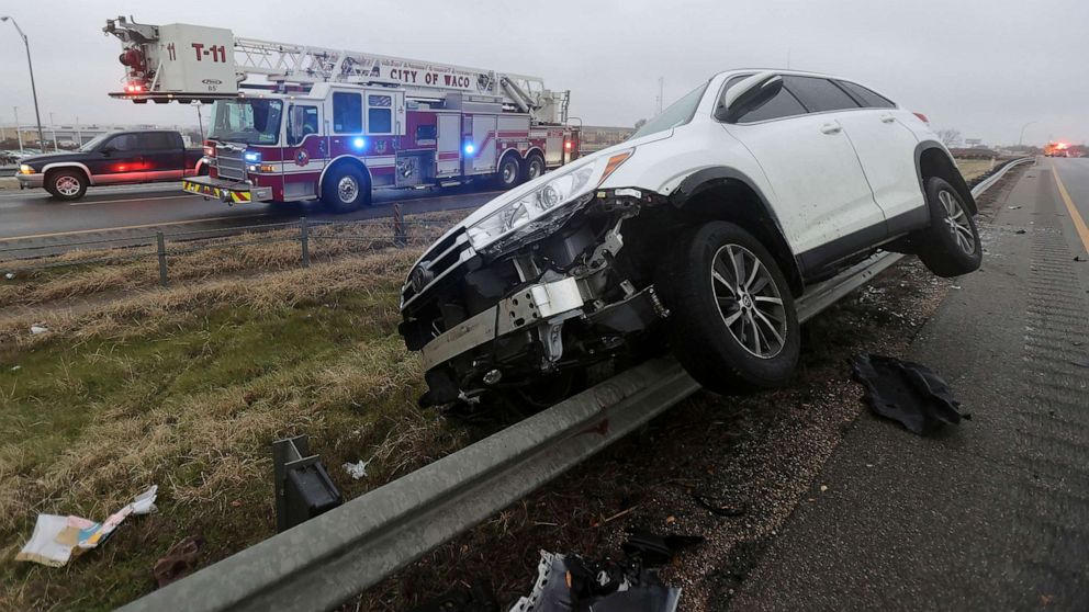 PHOTO: A vehicle rests on a barricade as the driver lost control and slid off Highway 6, Jan. 31, 2023 in Waco, Texas.