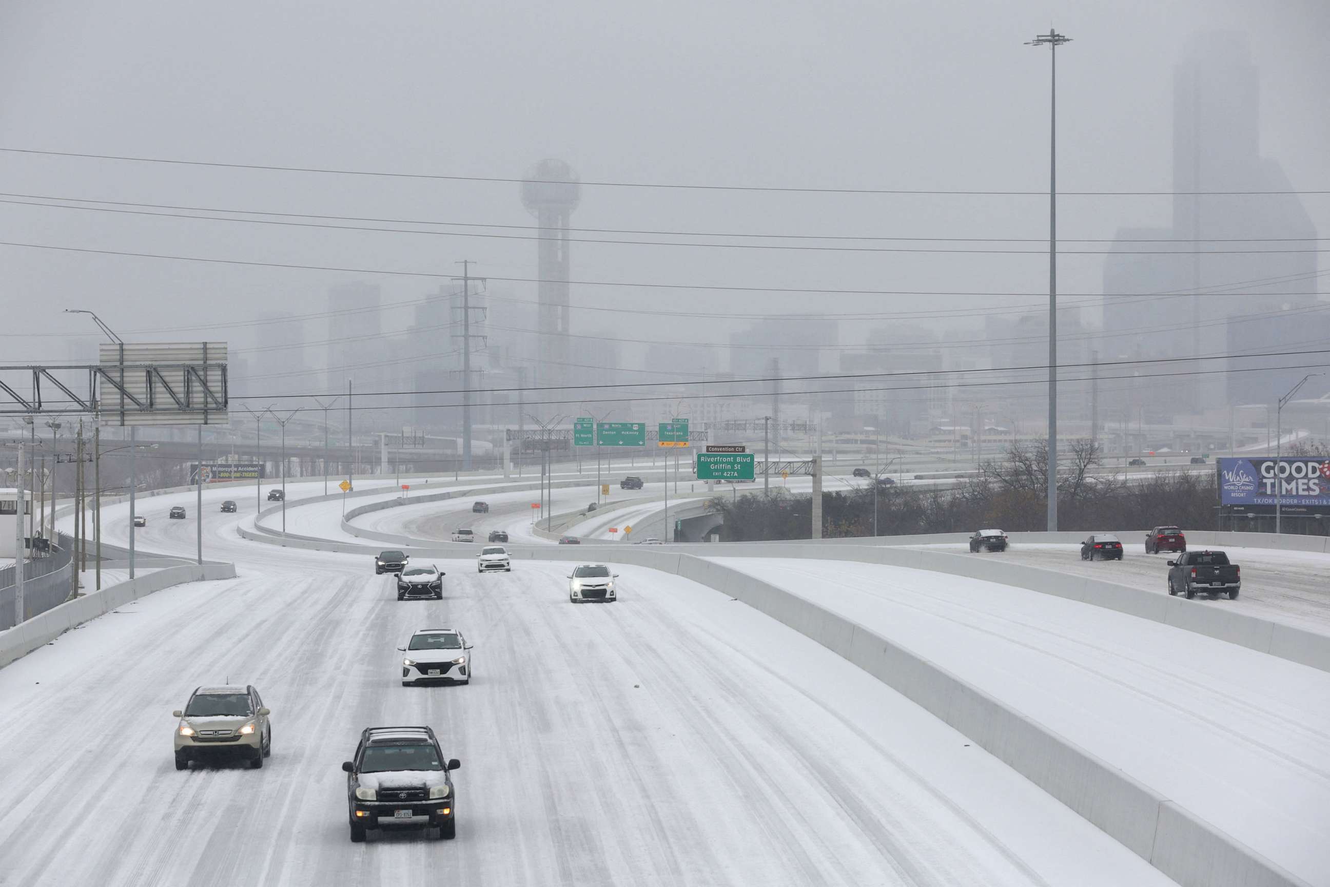 PHOTO: Cars drive down an icy highway as cold weather moves through Dallas, Jan. 31, 2023.