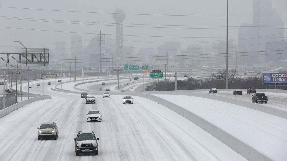 PHOTO: Cars drive down an icy freeway on January 31, 2023 as cold weather sweeps through Dallas.