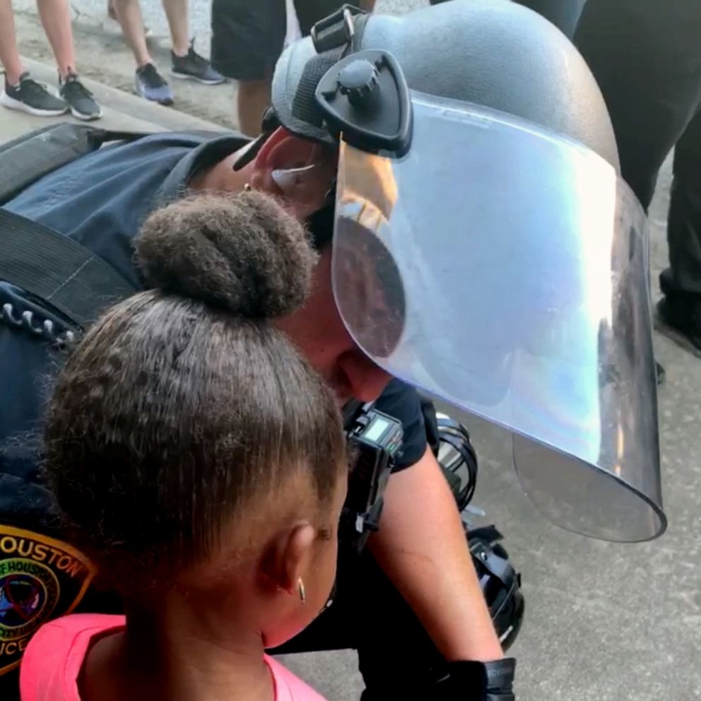 VIDEO: Police officer comforts little girl after she asks: 'Are you going to shoot us?'