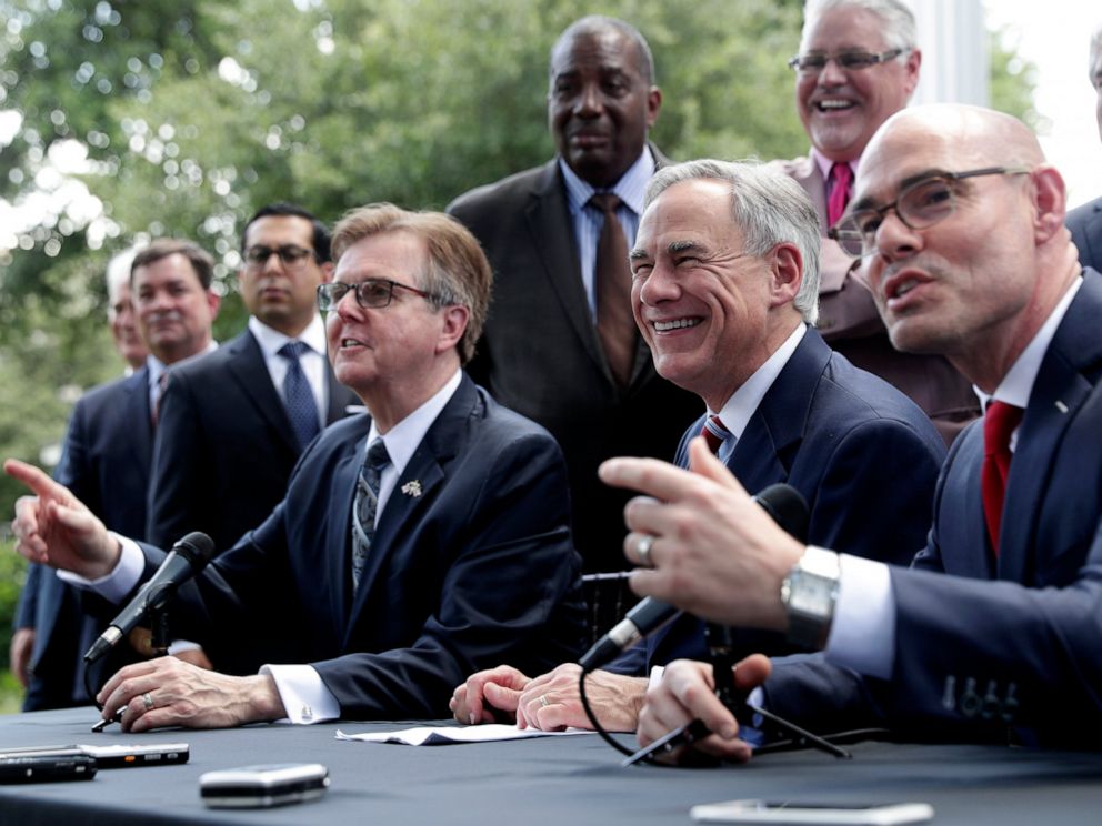 PHOTO: Texas Gov. Greg Abbott, Lt. Governor Dan Patrick, and Speaker of the House Dennis Bonnen, seated right, and other law makers attend a joint press conference to discuss teacher pay and school finance.