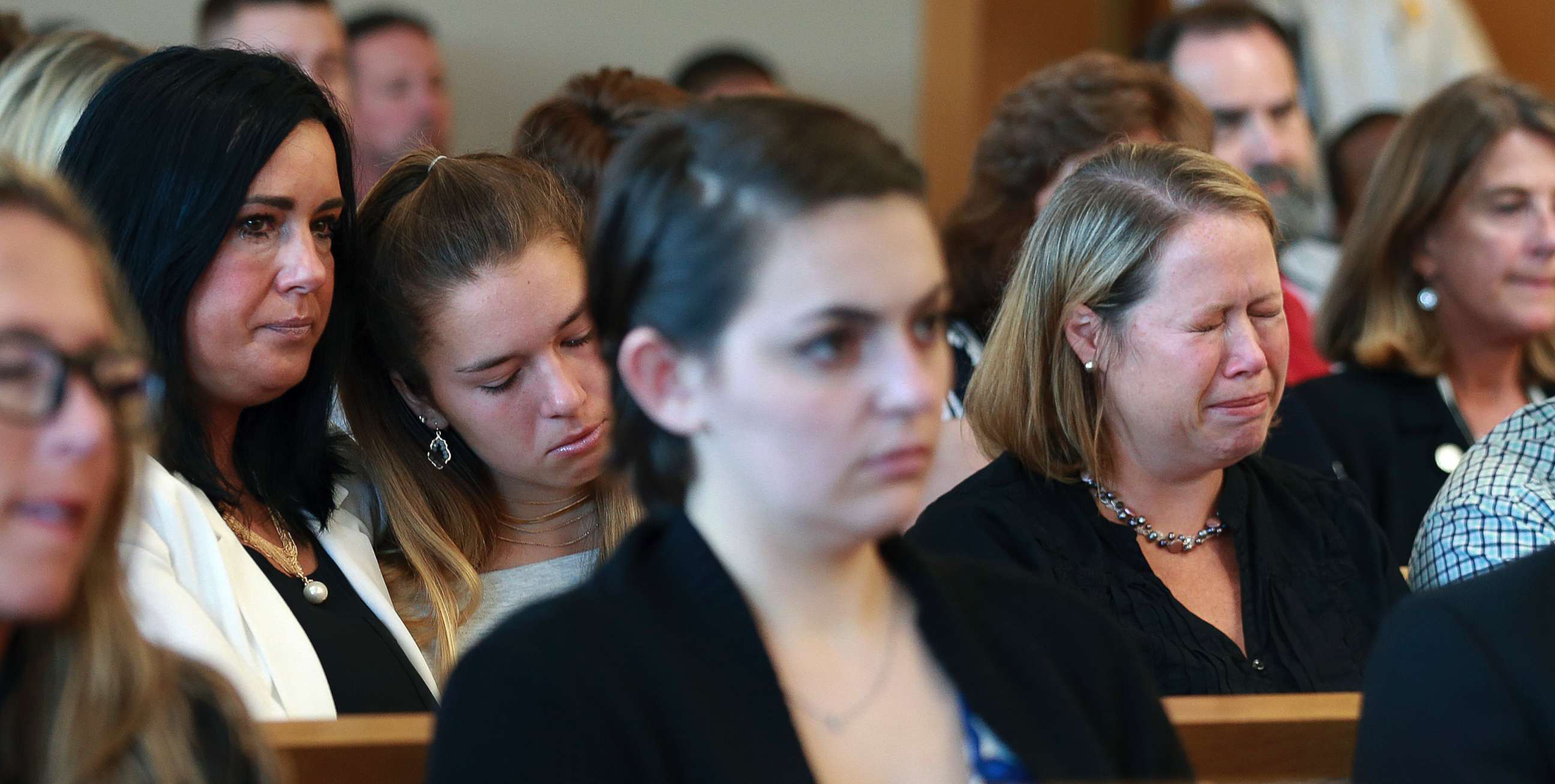 PHOTO: Conrad Roy III's mother Lynn, left, listens as her husband Conrad Roy Jr. reads his victim impact statement in court in Taunton, Mass., before Michelle Carter's sentencing, August 3, 2017.