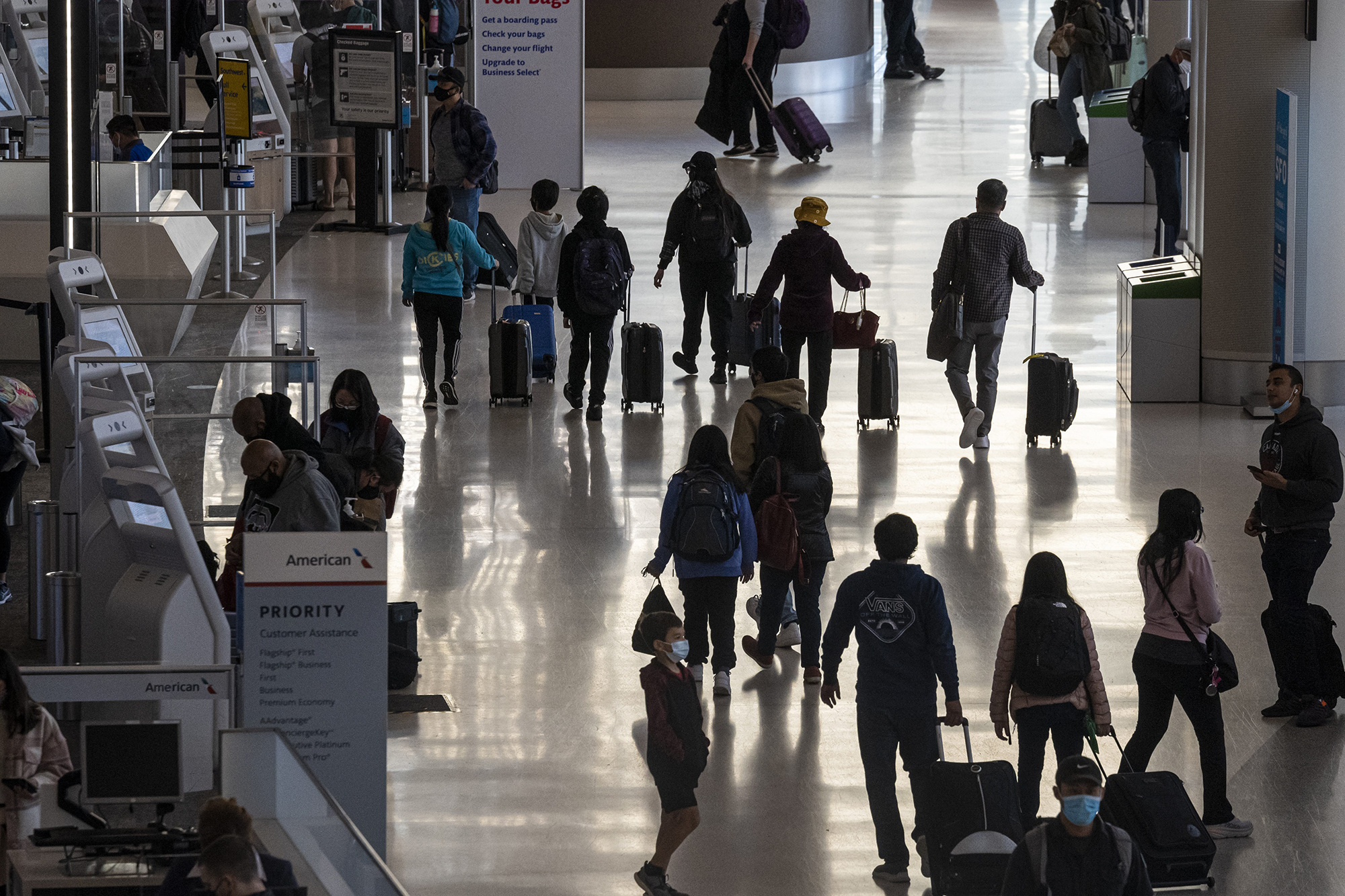 PHOTO: Travelers walk through the terminal at the International Airport in San Francisco,  Nov. 24, 2021. 