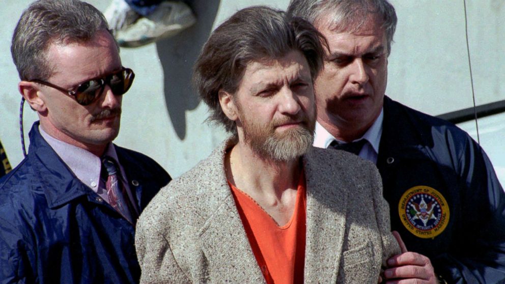 PHOTO: Ted Kaczynski, better known as the Unabomber, is flanked by federal agents as he is led to a car from the federal courthouse in Helena, Mont., April 4, 1996.