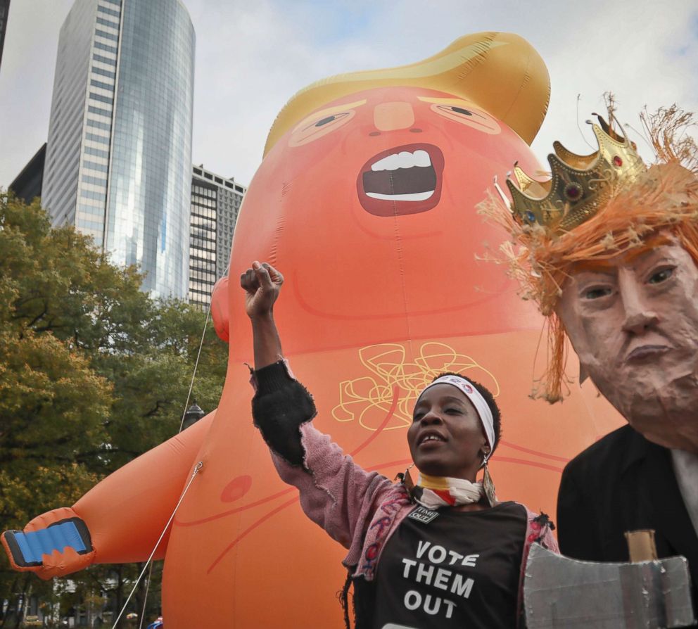 PHOTO: Therese Okoumou joins a protest calling for the impeachment of the president during a rally displaying a 20-foot helium-filled balloon parody of Trump known as "Baby Trump Balloon," Oct. 28, 2018, in New York.