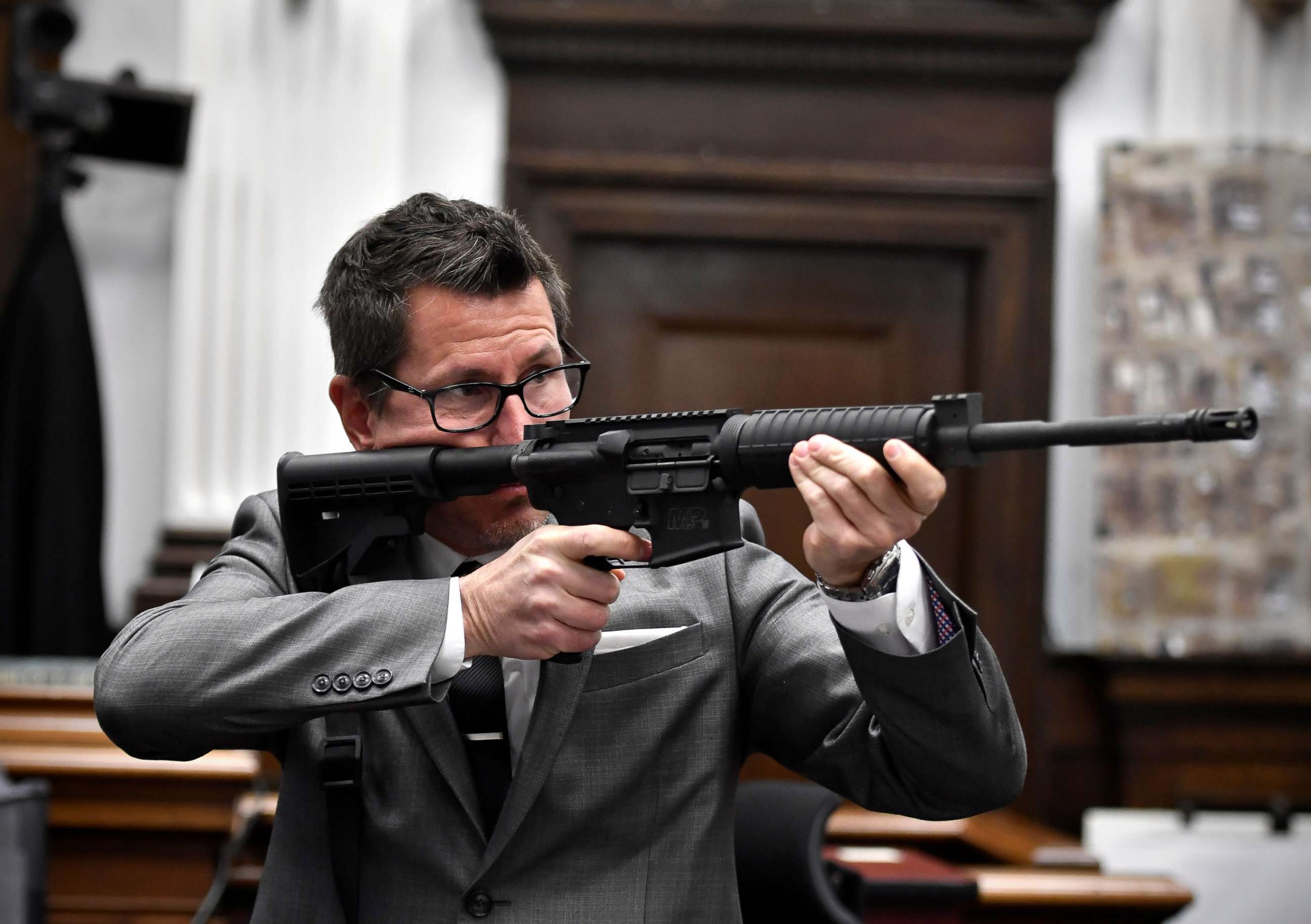 PHOTO: Assistant District Attorney Thomas Binger holds Kyle Rittenhouse's gun as he gives the state's closing argument in Kyle Rittenhouse's trial at the Kenosha County Courthouse on Nov. 15, 2021 in Kenosha, Wis. 