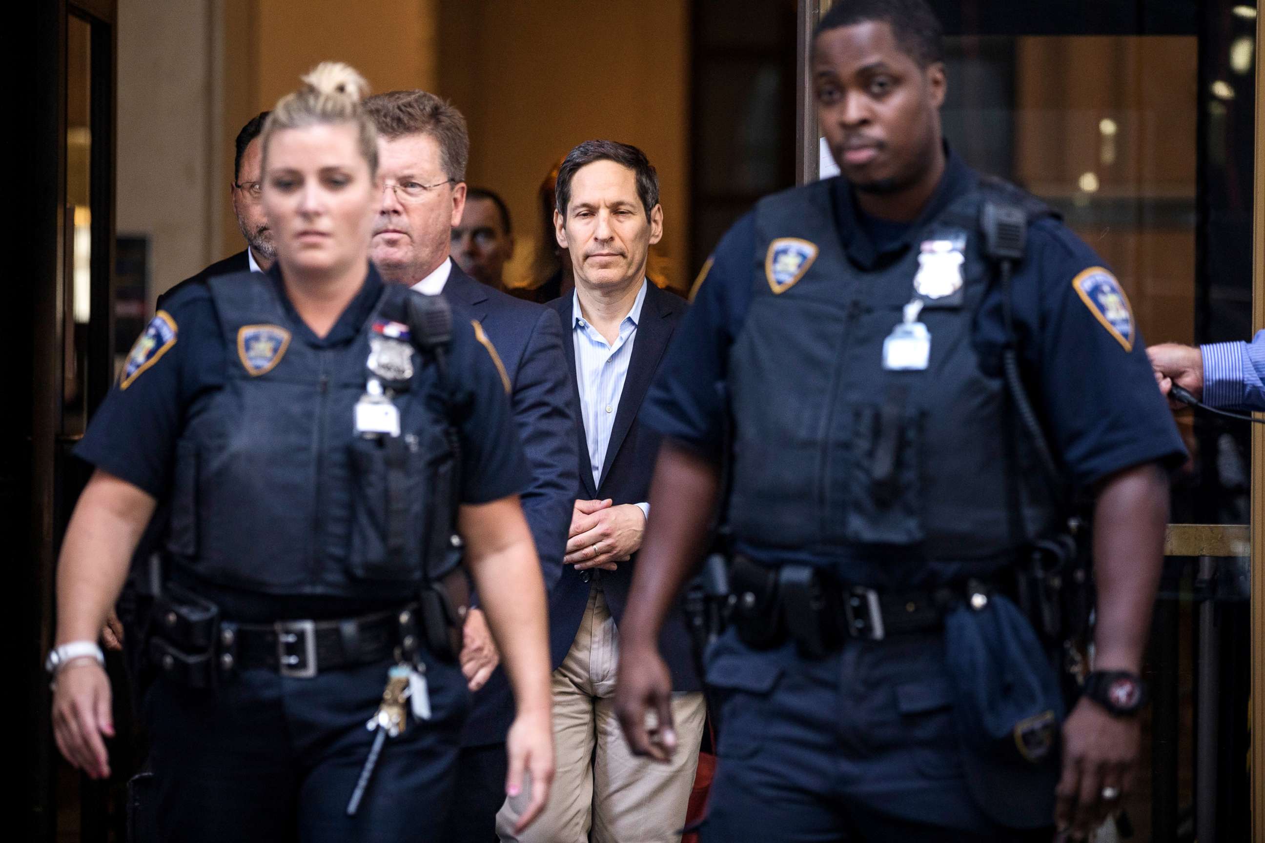 PHOTO: Tom Frieden (center), former Director of the Centers for Disease Control and Prevention, exits Brooklyn Criminal Court following his arrest on sex abuse charges, Aug. 24, 2018, in New York City.