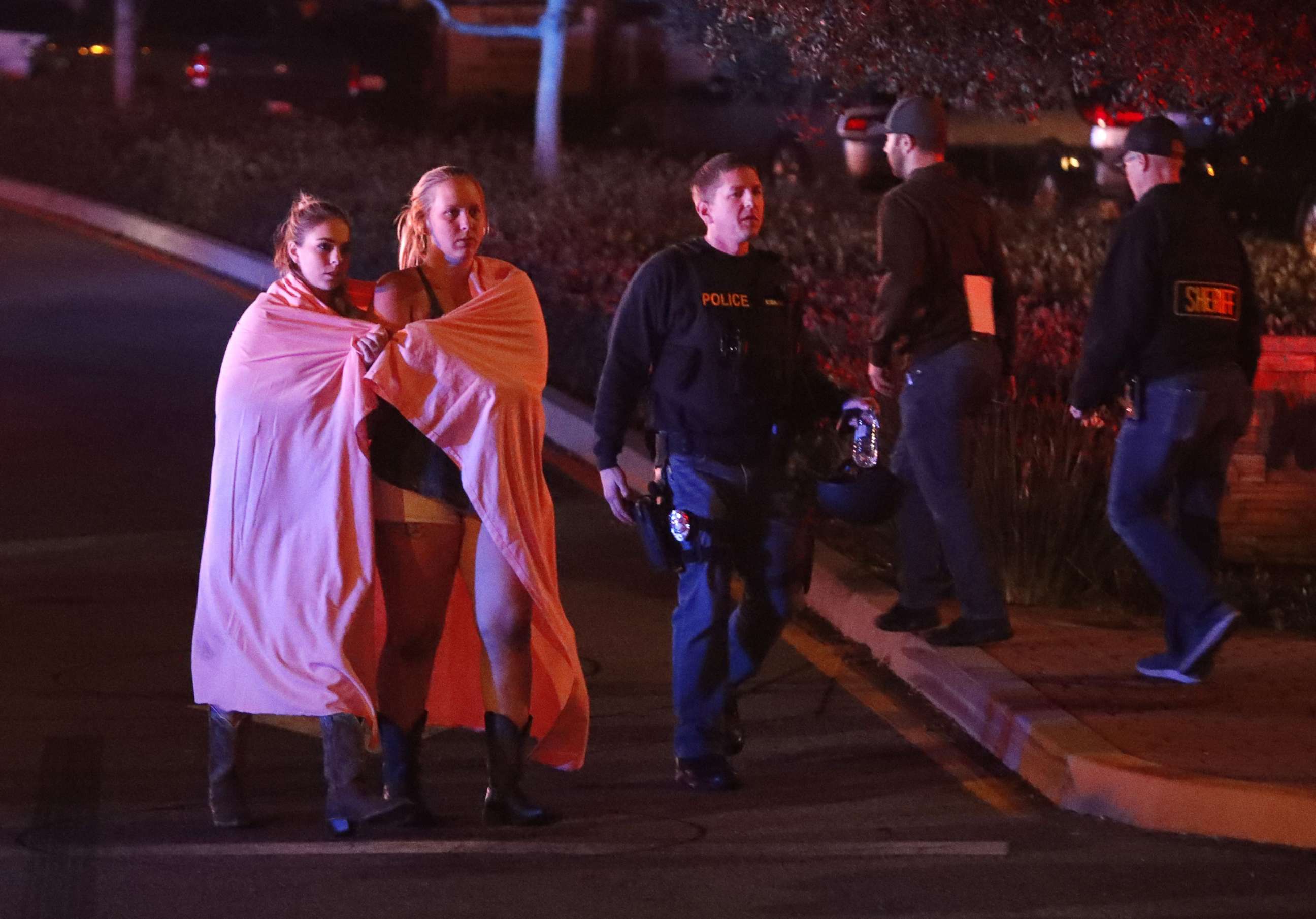 PHOTO: Two women wearing blankets leave the area near the Borderline Bar and Grill after a mass shooting in Thousand Oaks, Calif., Nov. 8, 2018.