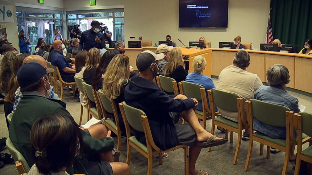 PHOTO: Members of the community participate in an emergency meeting of the trustees of the Coronado Unified School District after an incident during a basketball game between Coronado High School and Orange Glen High on June 19, 2021.