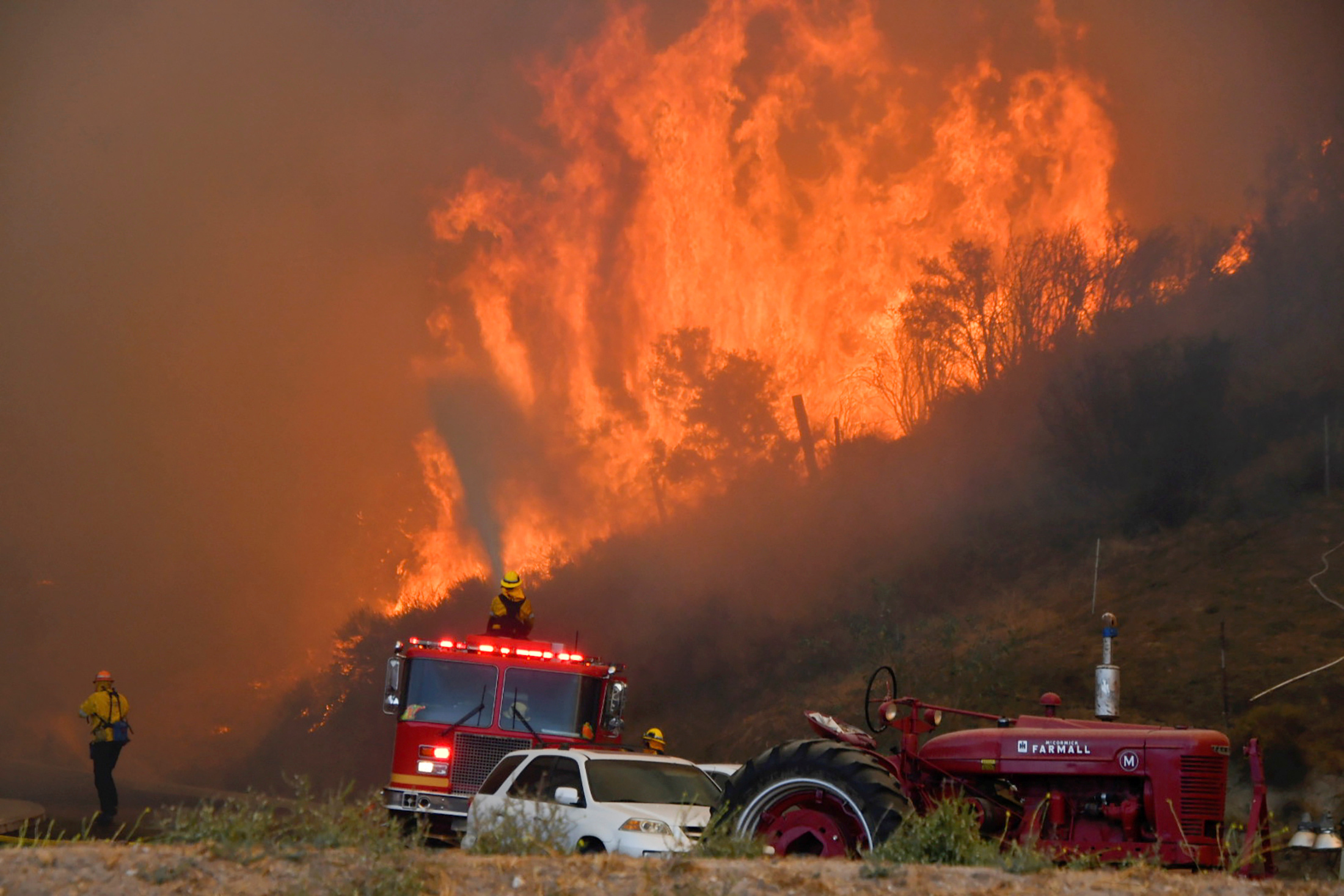 PHOTO: Firefighters arrive to battle the Tick fire, a wind driven wild fire in the hills of Canyon Country north of Los Angeles, Oct. 24, 2019.