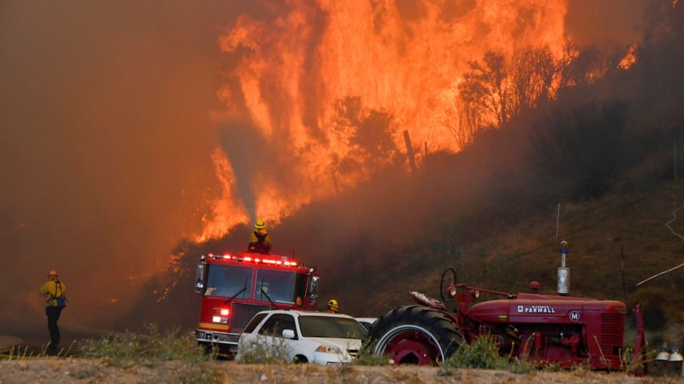 PHOTO: Firefighters arrive to battle the Tick fire, a wind driven wild fire in the hills of Canyon Country north of Los Angeles, Oct. 24, 2019.
