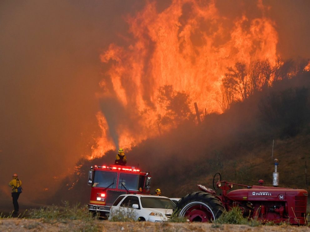 PHOTO: Firefighters arrive to battle the Tick fire, a wind driven wild fire in the hills of Canyon Country north of Los Angeles, Oct. 24, 2019.