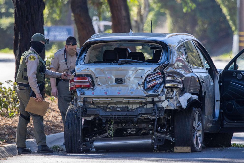PHOTO: Los Angeles County Sheriff deputies gather evidence from the car that golfer Tiger Woods was driving when seriously injured in a rollover accident, Feb. 23, 2021 in Los Angeles.