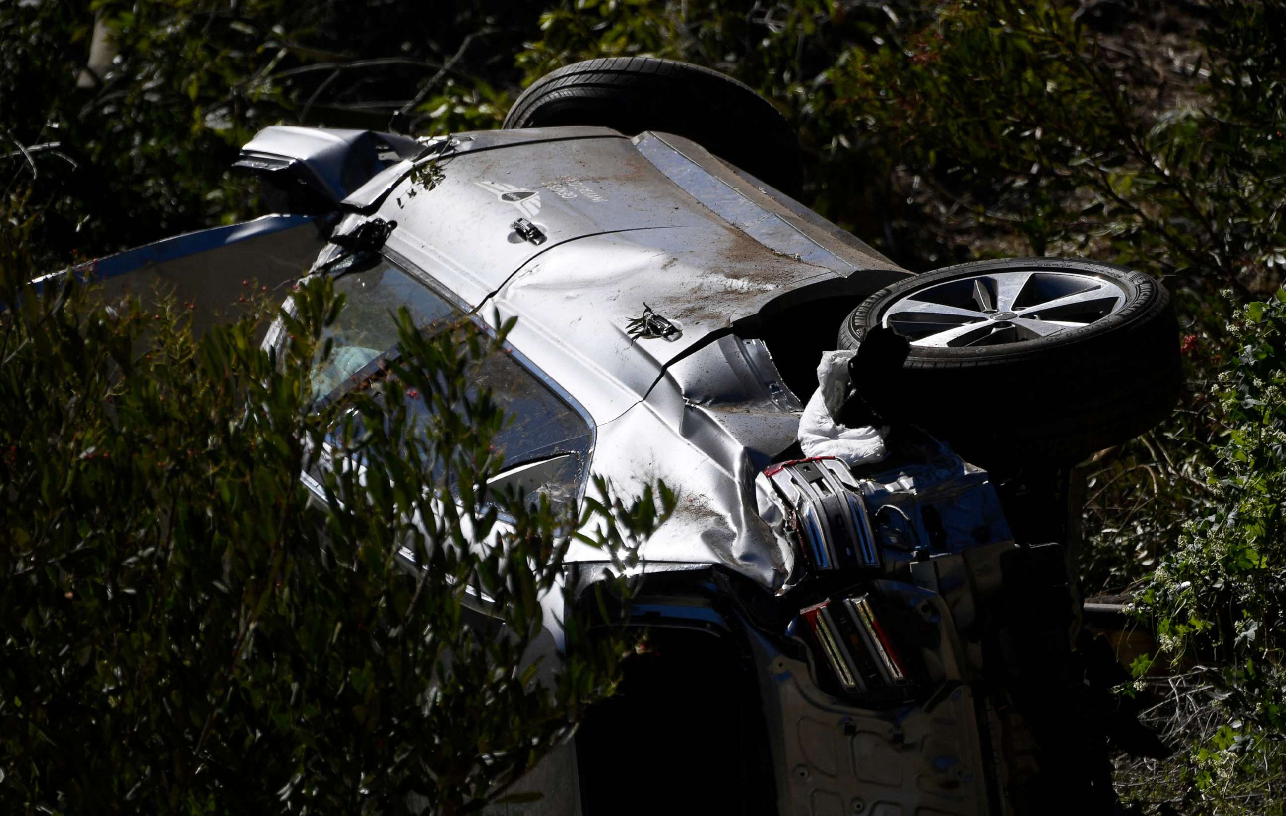 PHOTO: The vehicle driven by golfer Tiger Woods on Feb. 23, 2021 lies on its side in Rancho Palos Verdes, Calif., after a rollover accident. 