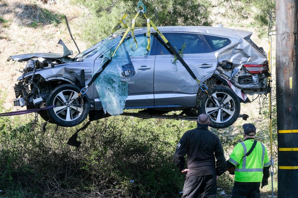 PHOTO: In this Feb. 23, 2021, file photo, a crane is used to lift a vehicle following a rollover accident involving golfer Tiger Woods, in the Rancho Palos Verdes suburb of Los Angeles.