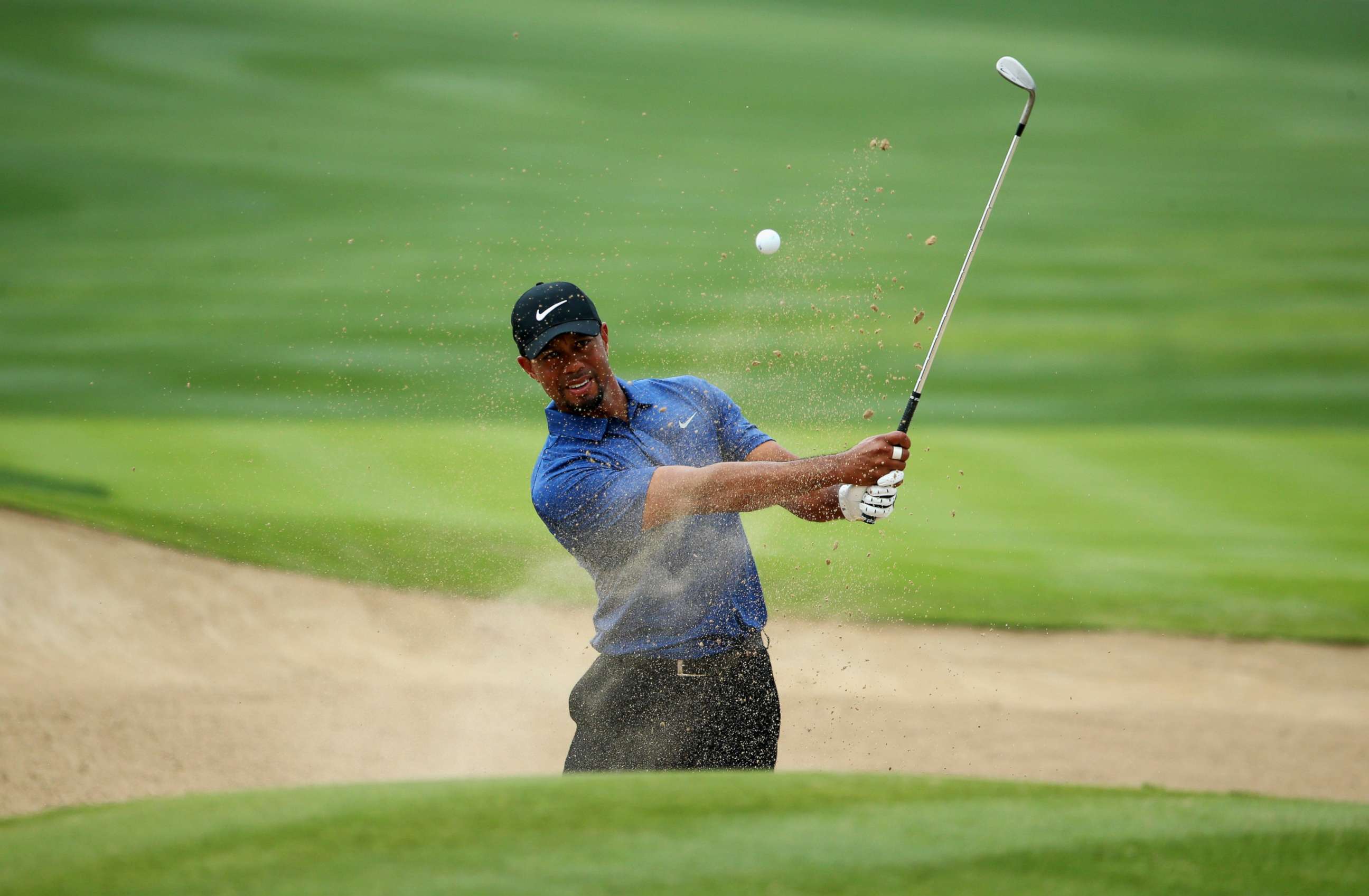 PHOTO: Tiger Woods plays from a bunker on the 6th hole during the first round of the Omega Dubai Desert Classic at Emirates Golf Club in this Feb. 2, 2017 file photo in Dubai.