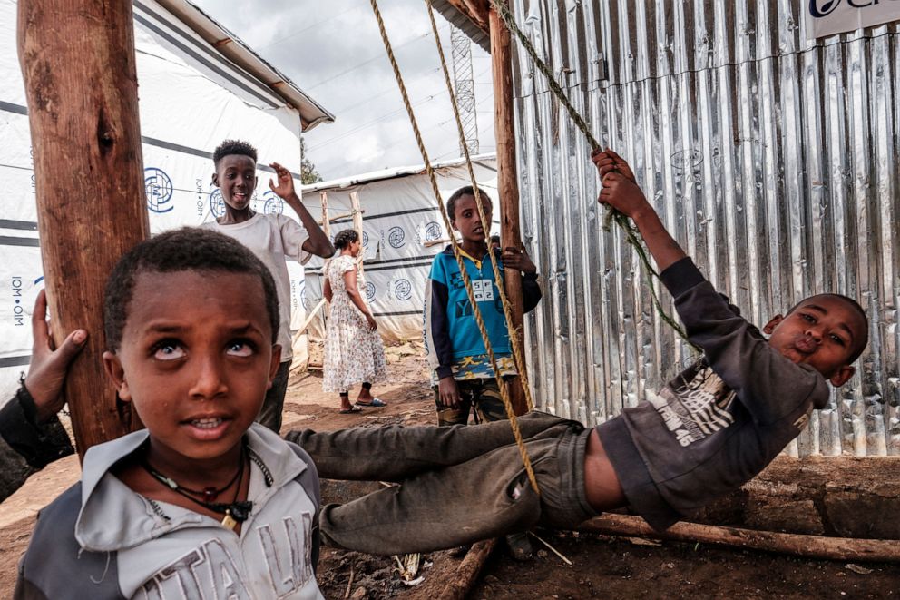 PHOTO: Internally displaced children play at a camp in the town of Azezo, Ethiopia, July 12, 2021. 
