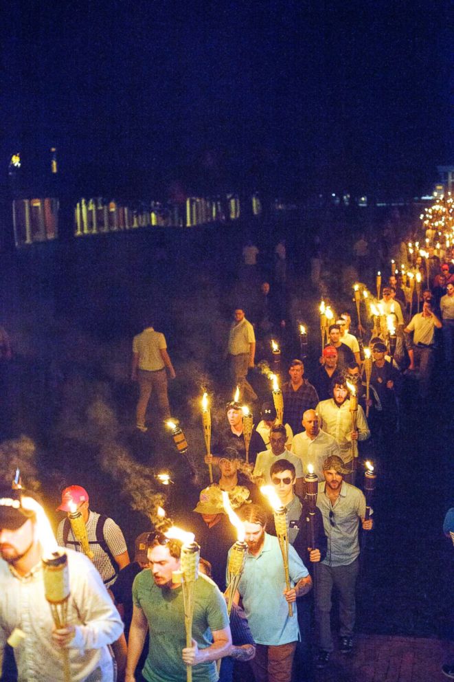 PHOTO: Neo Nazis and White Supremacists march the night before the 'Unite the Right' rally in Charlottesville, Va., Aug. 12, 2017.