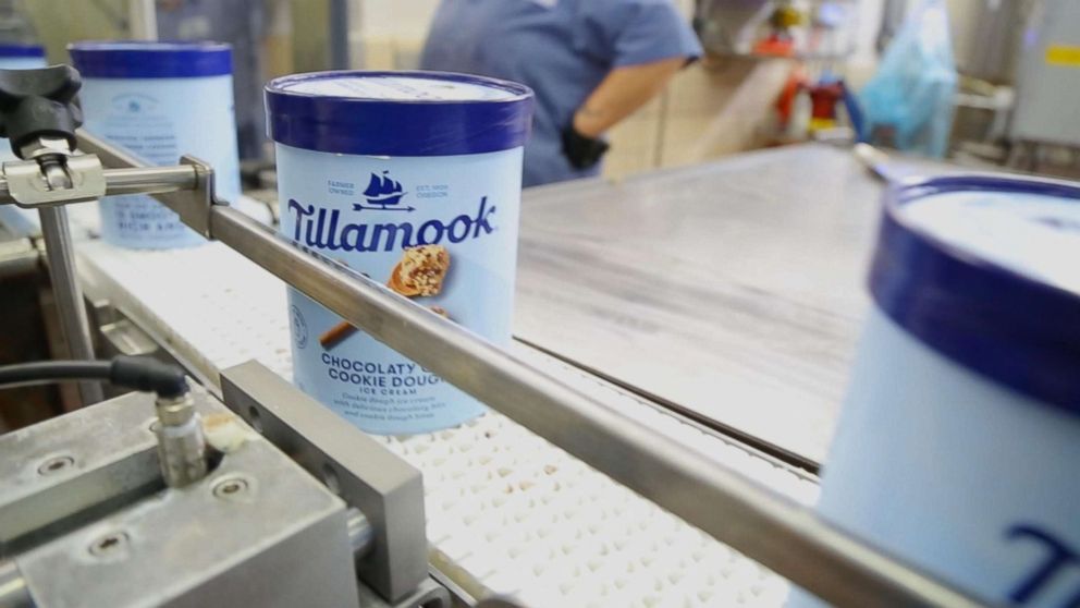 PHOTO: Containers of ice cream run along a conveyor belt at Tillamook Creamery in Tillamook, Ore.