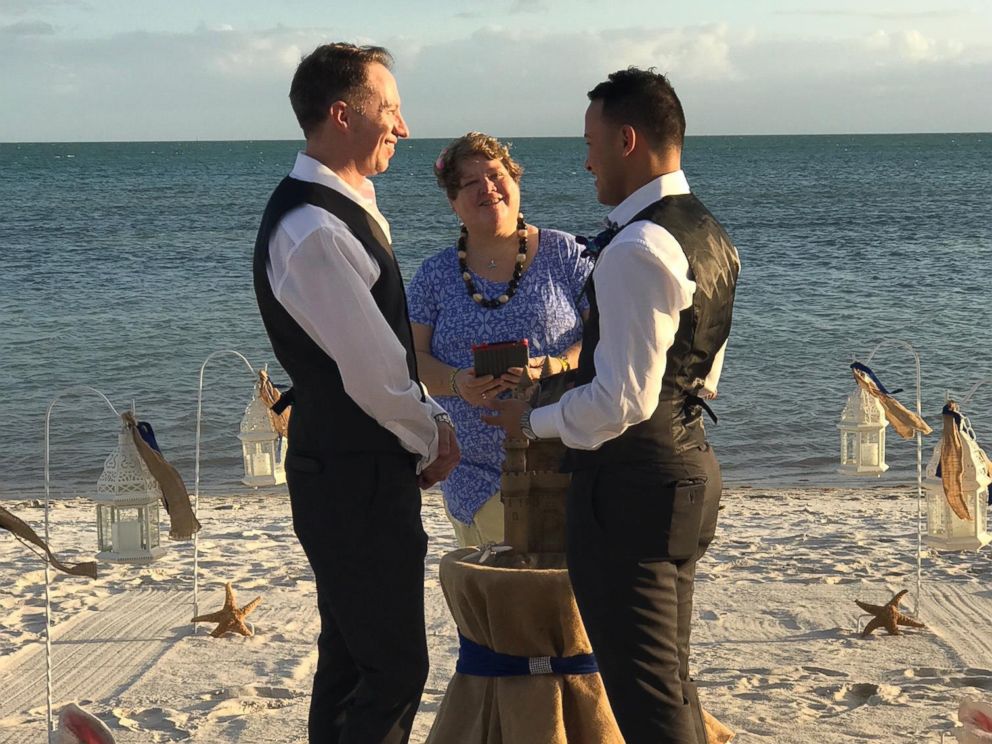 PHOTO: Army Chaplain Tim Brown of Sanford, N.C., left, marries his fiance, Sergio Avila, on the beach in January 2017.