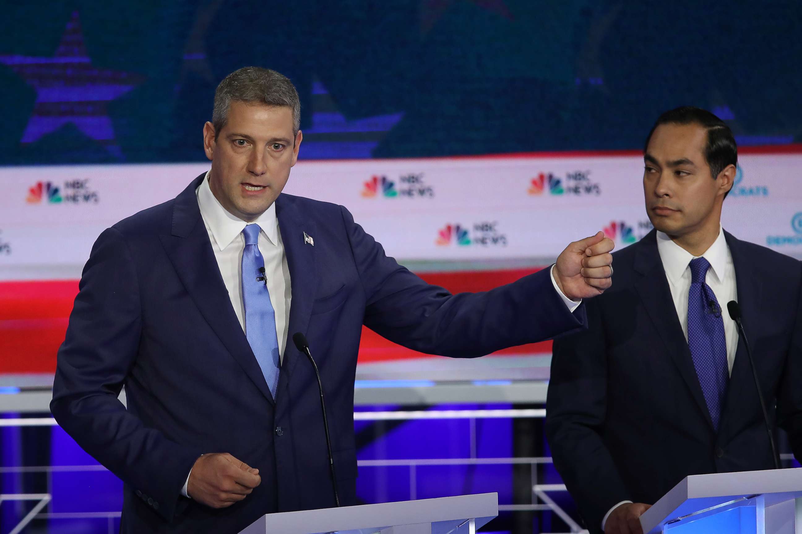 PHOTO: Rep. Tim Ryan speaks as former housing secretary Julian Castro looks on during the first night of the Democratic presidential debate on June 26, 2019, in Miami.