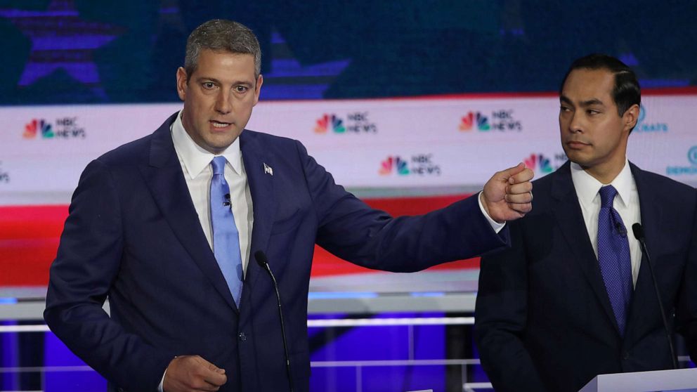 PHOTO: Rep. Tim Ryan speaks as former housing secretary Julian Castro looks on during the first night of the Democratic presidential debate on June 26, 2019, in Miami.