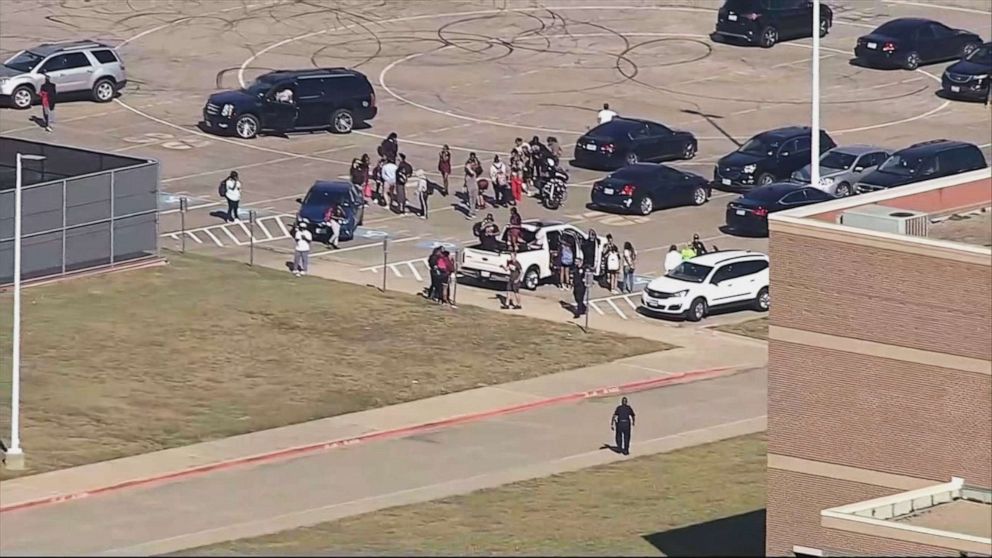 PHOTO: People gather outside Timberview High School in in Arlington, Texas, after reports of a shooting, Oct. 6, 2021.