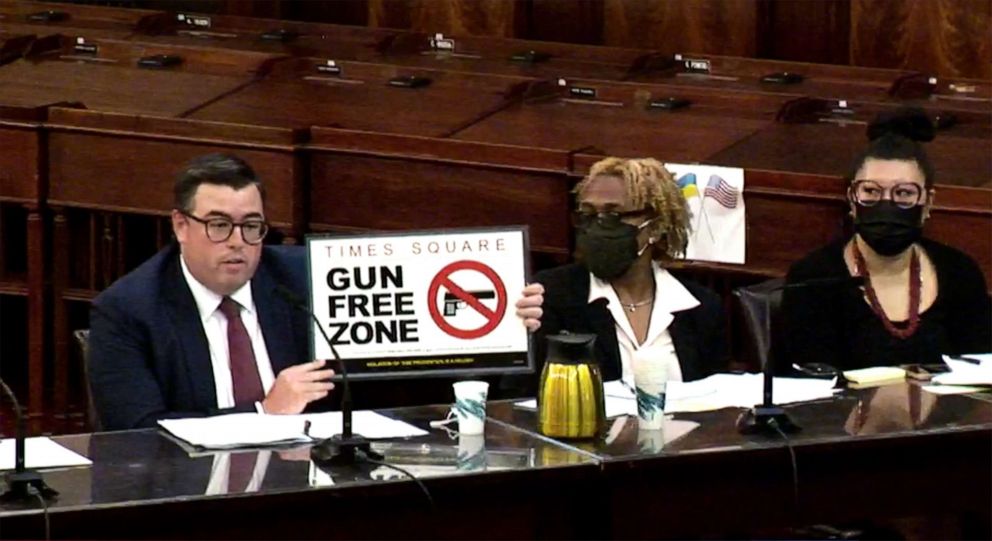 PHOTO: Robert Barrows, Executive Director, NYPD Legal Operations and Projects holds up a sign that will be displayed in Times Square while speaking at a City Council meeting on Aug. 29, 2022 in New York City.
