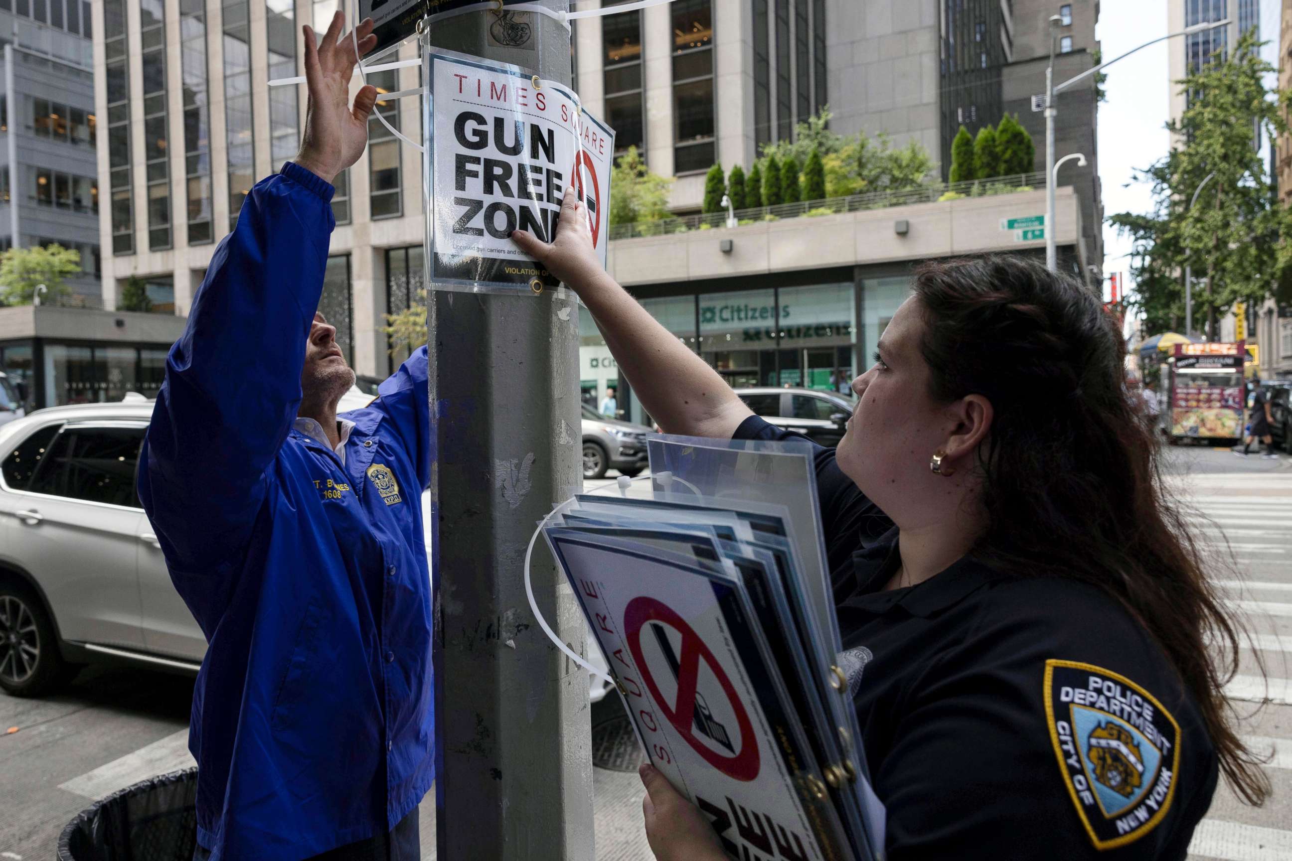 PHOTO: New York City Police Department Public Affairs officers set up signs reading "Gun Free Zone" around Times Square, Aug. 31, 2022, in New York.