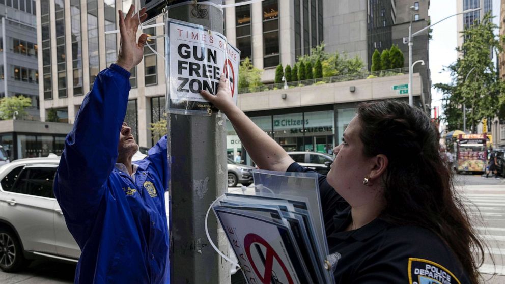 PHOTO: New York City Police Department Public Affairs officers set up signs reading "Gun Free Zone" around Times Square, Aug. 31, 2022, in New York.