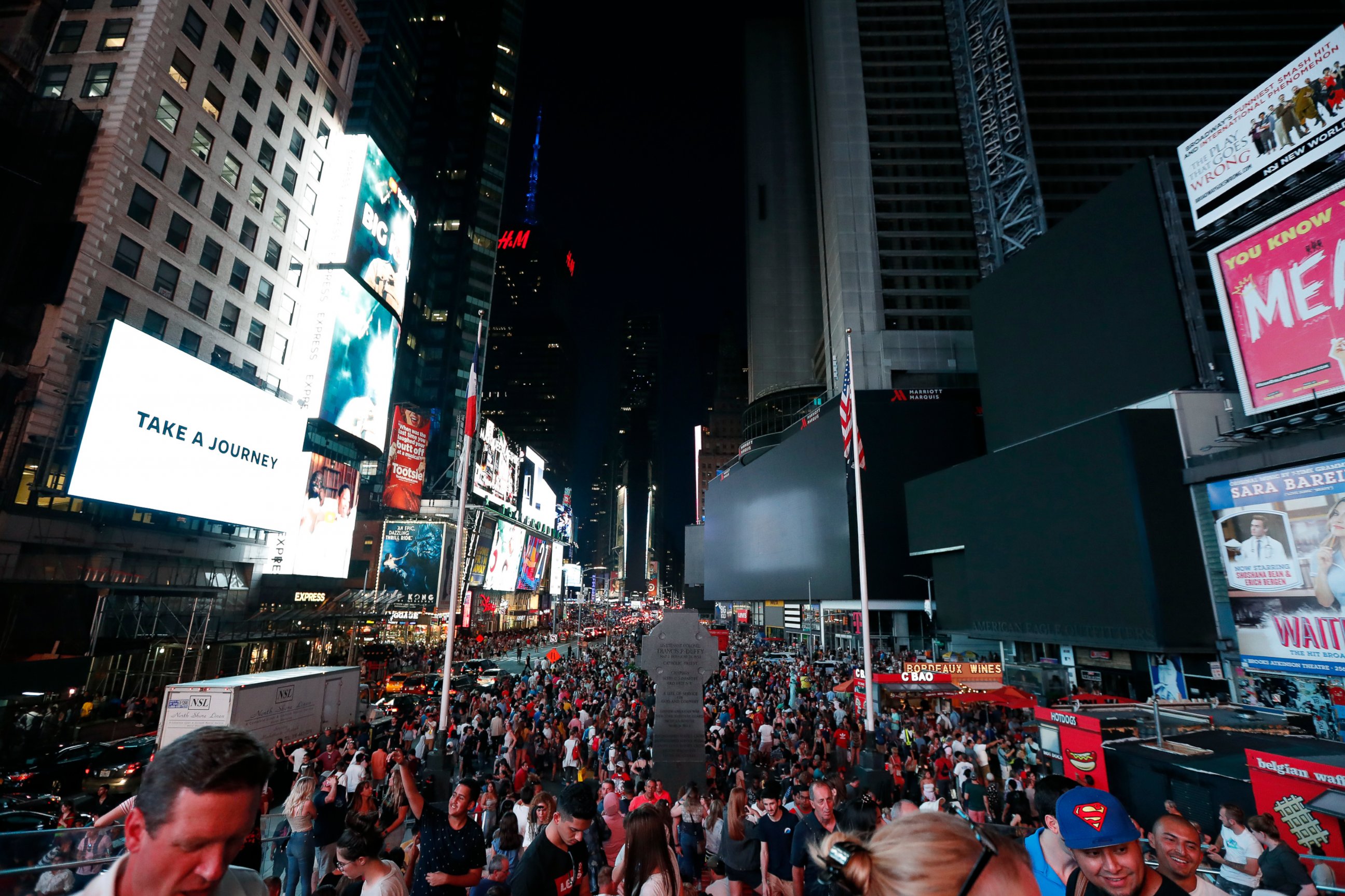 PHOTO: Screens in Times Square are black during a power outage, Saturday, July 13, 2019, in New York. 