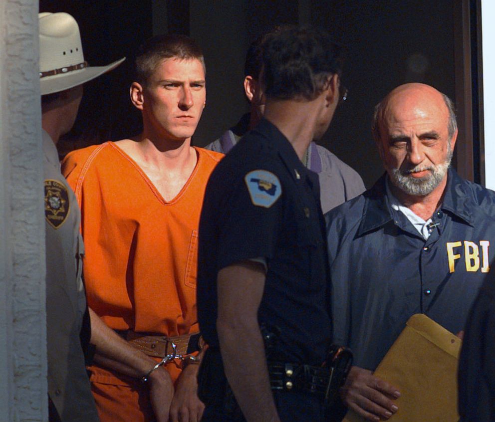 PHOTO: In this April 21, 1995 file photo, Timothy James McVeigh is led out of the Noble County Courthouse by state and federal law enforcement officials in Perry, Okla.