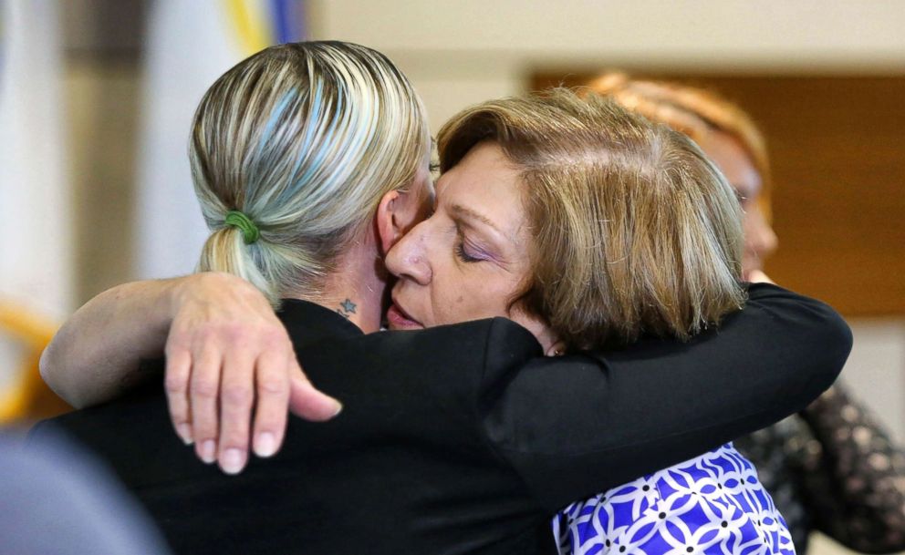 PHOTO: Tina Franke, right, the mother of murder victim Christine Franke, gets a hug from Christine's niece, Ashley, after a press conference, Nov. 5, 2018, at Orlando Police Department headquarters announcing the solving of the cold case from 2001.