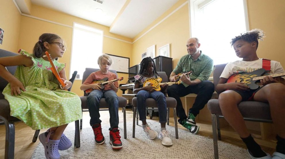 PHOTO: Brian Calhoun teaches kids how to play a TinkerTar.