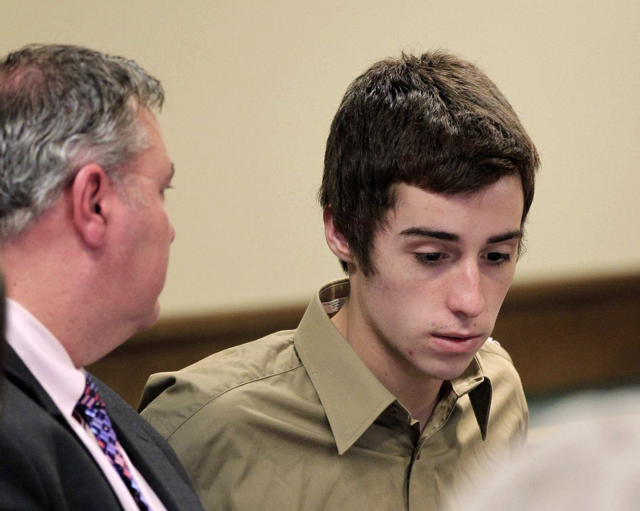 PHOTO: T.J. Lane, right, listens to his attorney during court proceedings in Juvenile Court, March 6, 2012, in Chardon, Ohio.