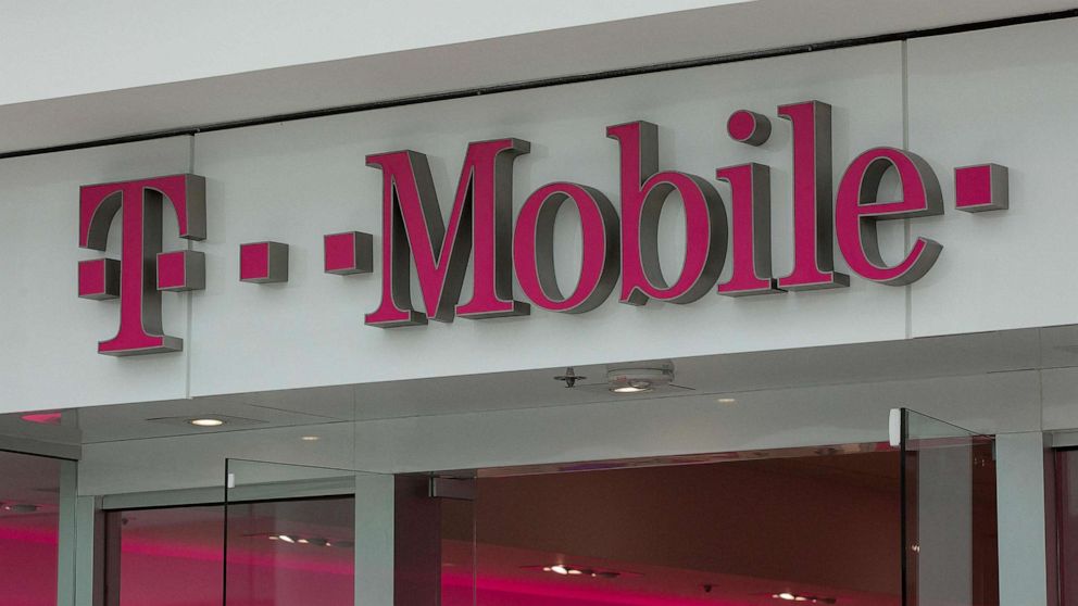 PHOTO: (FILES) In this file photo taken on July 26, 2019 The T-Mobile logo is seen outside a shop in Washington, DC. - US telecom company T-Mobile announced January 19, 2023 that a recent hack impacted 37 million of its customers' data.