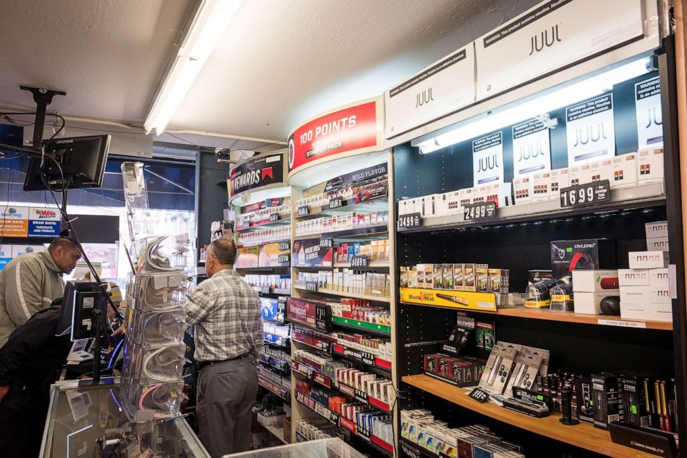 PHOTO: Packages of Juul Labs Inc. device kits and pods are displayed for sale next to tobacco products at a store in San Francisco, California, U.S., on Wednesday, June 26, 2019.
