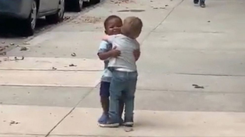 PHOTO: Two-year-old best friends, Finnegan and Maxwell, embrace on the street in this screen grab from viral video.