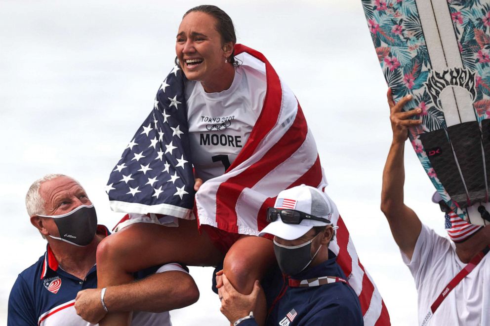 PHOTO: Carissa Moore celebrates after winning the women's Surfing gold medal final at the Tsurigasaki Surfing Beach, in Chiba, on July 27, 2021 during the Tokyo 2020 Olympic Games.