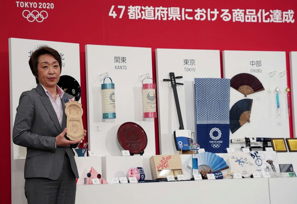 PHOTO: Tokyo 2020 President Seiko Hashimoto presents a series of licensed merchandise, traditional crafts from all of Japan's 47 prefectures, bearing the Tokyo 2020 emblem, at a display event in Tokyo, April 15, 2021.