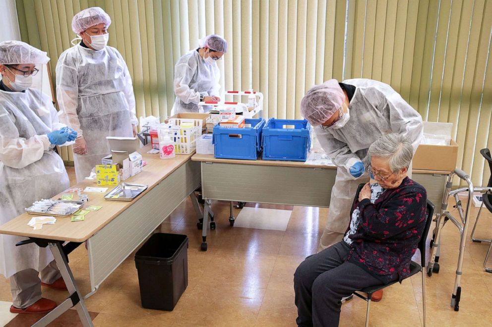 PHOTO: An elderly woman receives a dose of the COVID-19 vaccine in the Setagaya district of Tokyo on April 12, 2021, as Japan begins vaccinating the elderly.