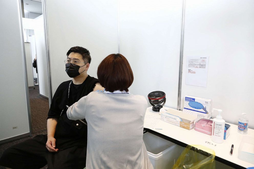 PHOTO: TA man receives the Moderna coronavirus vaccine at the Tokyo Metropolitan Government building on June 25, 2021.